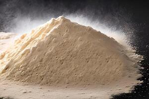 Heap of flour isolated on black background, studio shot and marketing presentation.c photo