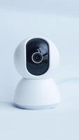 White smart home portable cctv for your home surveillance security isolated on white. photo