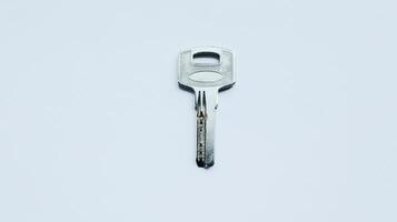 Silver metallic key isolated on white. photo