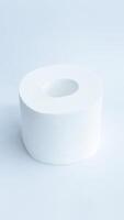 White toilet tissue roll isolated on white background. photo