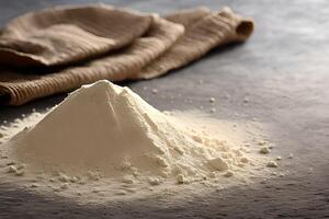 Heap of flour on the table, studio shot and marketing presentation. photo