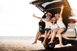 Family with Car travel driving road trip summer vacation in car in the sunset, Dad, mom and daughter happy traveling enjoy holidays and relaxation together get the atmosphere and go to destination photo