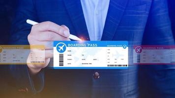 Hand holding boarding pass tickets air travel concept, Choosing checking electronic flight ticket. photo