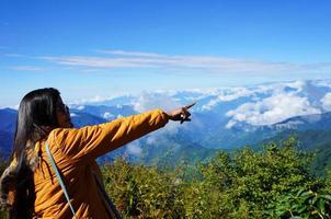 Tourist Teenage girl Showing Himalayan Mountain Range from Silk Route Sikkim photo