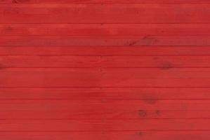 rojo de madera pared hecho de tablones foto
