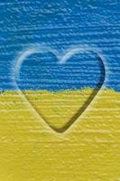 heart on Ukrainian flag painted on wall photo