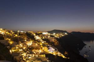 view of Oia village on Santorini island at sunset photo