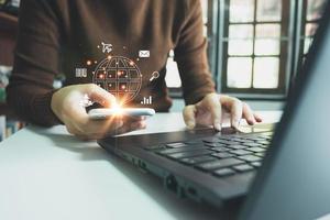 Search Engine optimization SEO concept, Businesswoman is using smartphone and laptop to search for information on Internet, Wireless Network, big data and accessing website information. photo