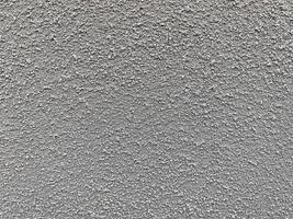 close up of gray stony wall background photo