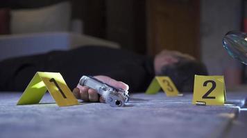 Suicide murder. Crime scene Investigation. Forensic expert examining the man who committed suicide and the evidence. video