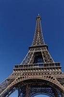 Eiffel tower in Paris against blue sky photo