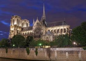 view on Notre-Dame de Paris Cathedral at night photo