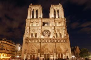 view on front side of Notre-Dame de Paris Cathedral at night photo