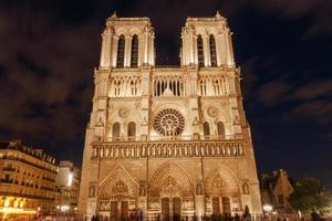 view on front side of Notre-Dame de Paris Cathedral at night photo