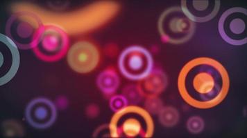 Abstract bokeh particles motion background with vibrantly colored concentric circles. Full HD and looping. video