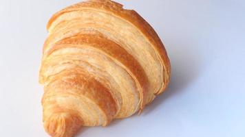 Fresh baked croissant on plate with copy space video