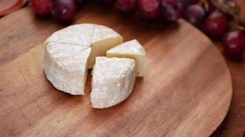 Camembert cheese on a bowl on table video