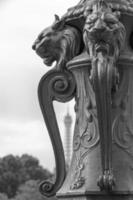 decoration on street lamp in Paris against Eiffel tower photo