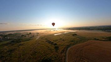 Hot Air Balloon, aerial view in the Fields video