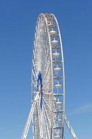 ferris wheel in Marseille against blue sky photo