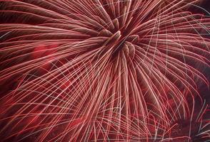 abstract holiday background, fireworks in night sky photo