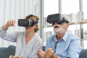 Happy senior couple, elderly family, caucasians mature, adult lover and retired man, woman wearing VR headset or visual reality goggles, gadget, play video game of simulator futuristic of technology photo