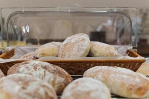 Fresh homemade Italian ciabatta bread in kitchen bakery shop. photo