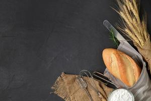 Homemade bread with flour and bakery equipment photo