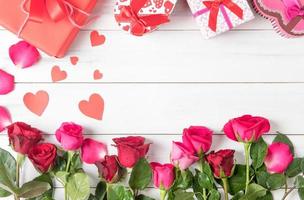 red and pink rose  with gift box on wood photo