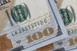close up of one hundred dollars banknotes photo