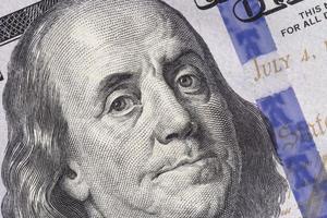 close up of Franklin on one hundred US dollars banknote photo
