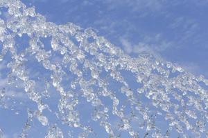 fountain jets against blue sky photo