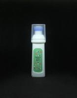 Shoes white anti stain cleaner liquid with built in blue brush object isolated cheap object photo on dark black background.