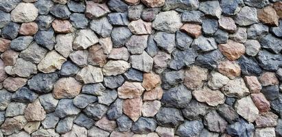 Colorful of big rock or stone wall for background. Group of object, Pattern wallpaper and Cracked concept photo