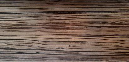 Pattern of dark brown wooden table or floor for background. Wood material, Abstract Wallpaper and Surface concept. photo