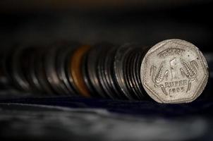 1 Rupee Indian coins selective focus photo