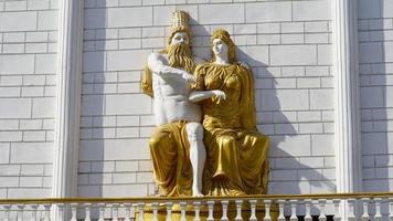 zeus and hermes statue of golden colour photo