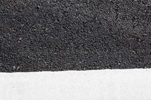 White line on new asphalt detail,Street with white line texture photo