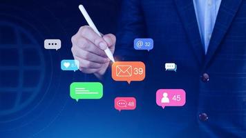 People using social media and digital online marketing concepts with icons such as notifications, messages, comments on the screen. photo