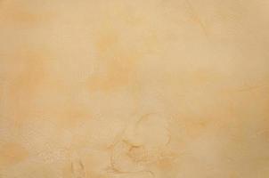 Texture of a  yellow brown concrete as a background,yellow brown grungy wall - Great textures for background photo