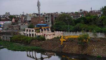 crane removing garbage from drain photo