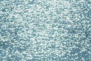 turquoise abstract sunshine on water background photo