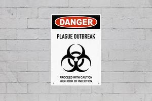 Danger plague outbreak sign on a wall photo