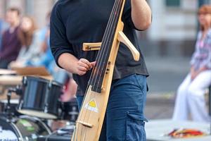 Musician playing with his electric double bass photo