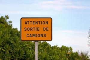 Warning truck exit sign in French photo