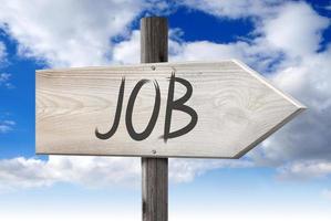 Job - Wooden Signpost with one Arrow and Cloudy Sky in Background photo