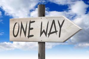 one Way - Wooden Signpost with one Arrow and Cloudy Sky in Background photo