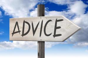 Advice - Wooden Signpost with one Arrow and Cloudy Sky in Background photo