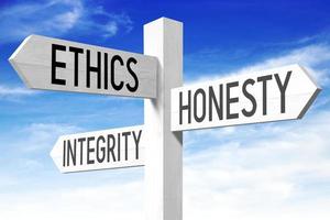 Ethics Concept - Wooden Signpost with Three Arrows and Sky in Background photo