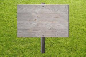 Empty Wooden Board on Grass photo